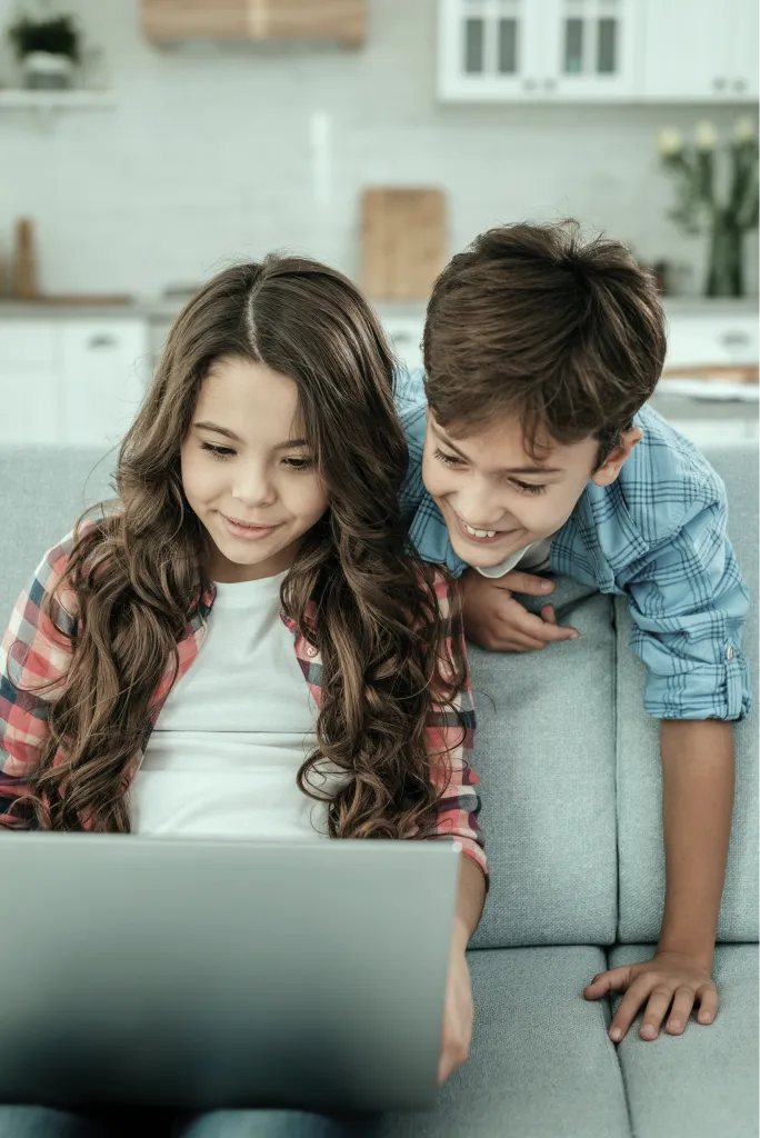 A girl and a boy learning together at home